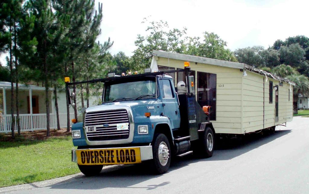 truck hauling mobile home