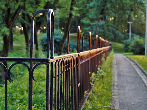 metal gate betwixt a mobile home park